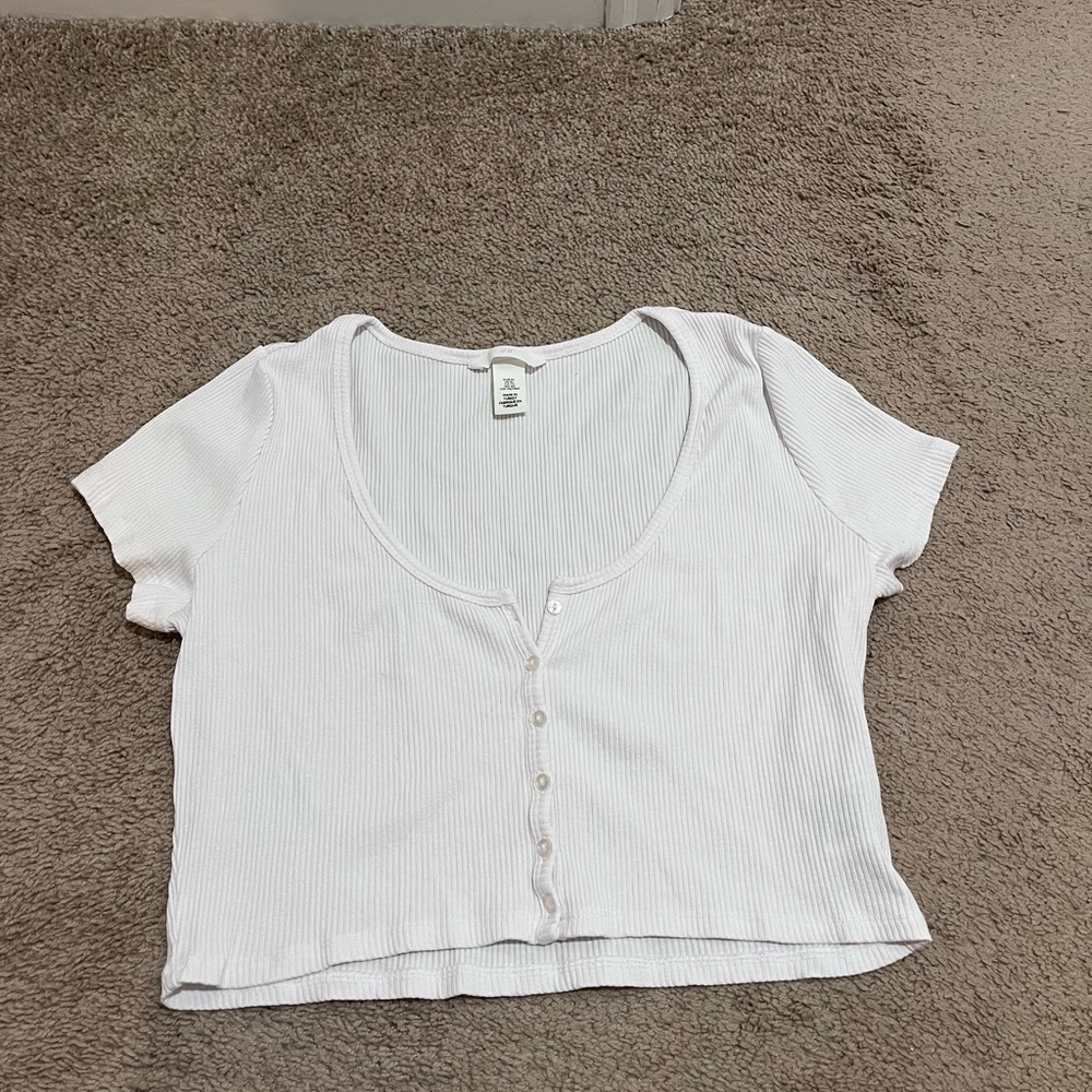 This shirt has never been worn before and is in excellent condition.